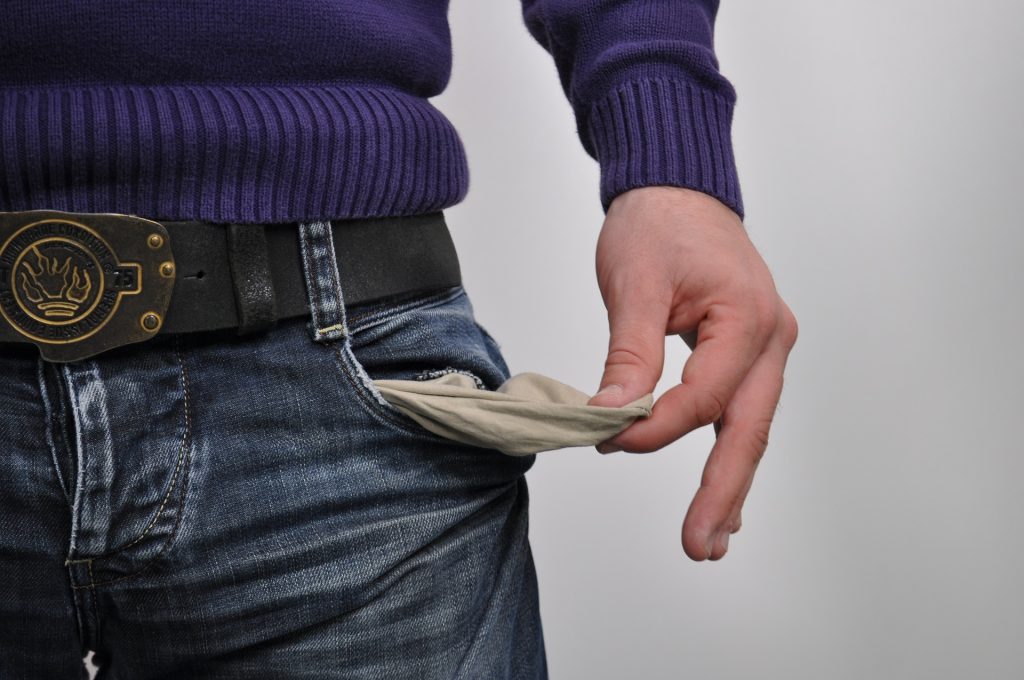 Image of person with empty pockets