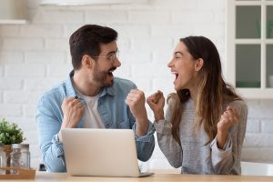 image of two people celebrating